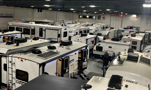 Ontario RV Shows showroom floor with RVs lined up