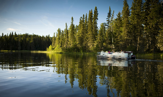 Boat cruise on the Hanging Heart Lakes, Prince Albert National Park. 
