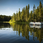 Boat cruise on the Hanging Heart Lakes, Prince Albert National Park. 
