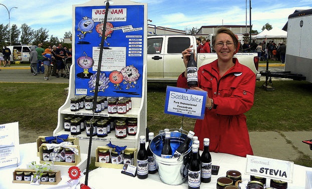 Barb Geisbrecht at the Fort St. John farmers market.  She is selling saskatoon jams, sauces, juice concentrate, candles, pie filling and pies.