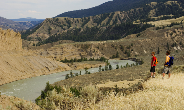 hikers looking at a river