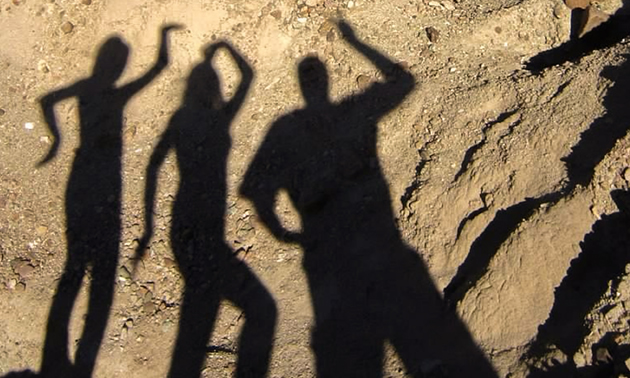 Glyn Jena and Haley's shadows thoroughly enjoy Rainbow Basin in Mojave Desert.
