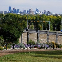 The Botanical Gardens of Silver Springs in Calgary with the city skyline far in the background.