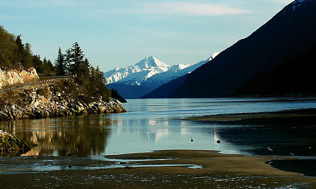 mountains and trees by a lake in Skagway