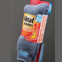 Grey Heat Holder socks in their package. 