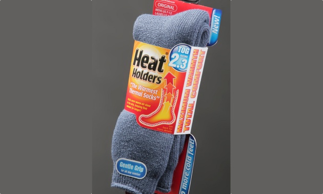 Grey Heat Holder socks in their package. 