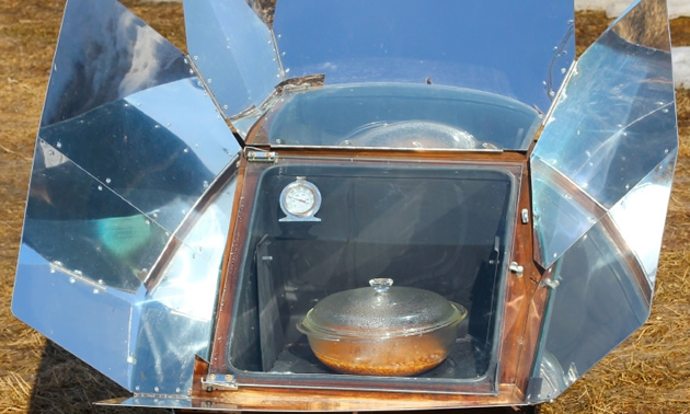 Solar oven cooking dinner.