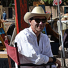 man sitting at a market stall