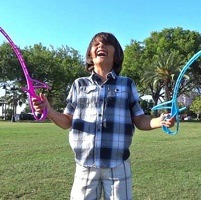 A boy playing RingStix.