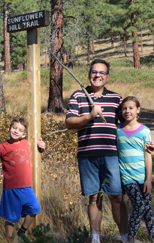 Jose Tomas, Daphne and Oliver Gonzalez starting out on a hike up sunflower hill. 