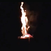 A photo of an upright log buring.