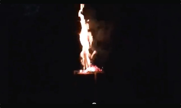 A photo of an upright log buring.