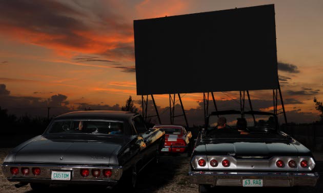 Cars at a drive-in movie theatre