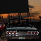 Cars at a drive-in movie theatre