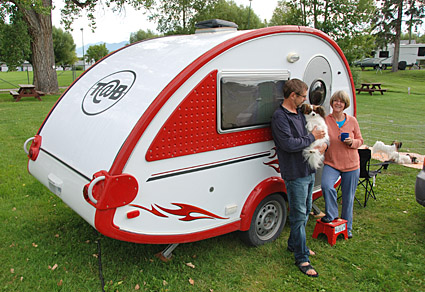 Photo of Gary and Maggie with their Tab trailer.