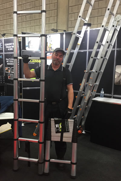 Dan Gauthier demonstrates the telescoping ladder fully extended and collapsed for transport and storage.