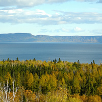 view of a land formation over water