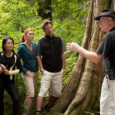 A man guiding a tourist group. 