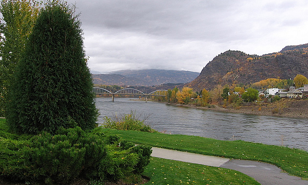 bridge with water and houses along the river