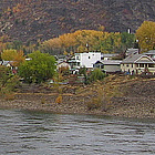 bridge with water and houses along the river