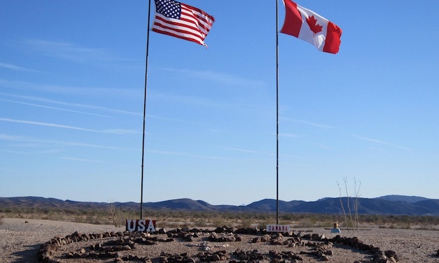 Canadian and American flags in the Valley of Names near Yuma, Arizona