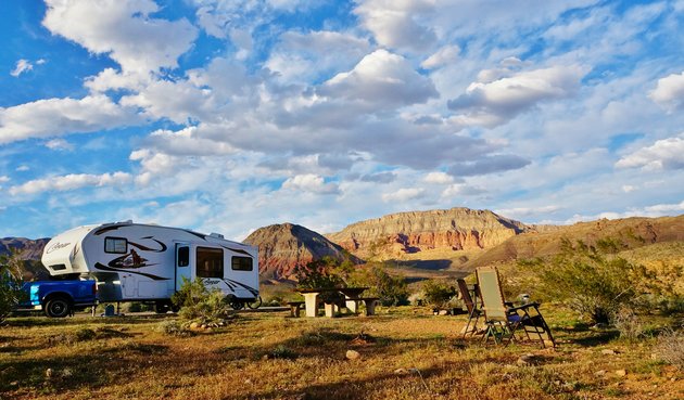 RV in Arizona with the mountains and sunny skies in background