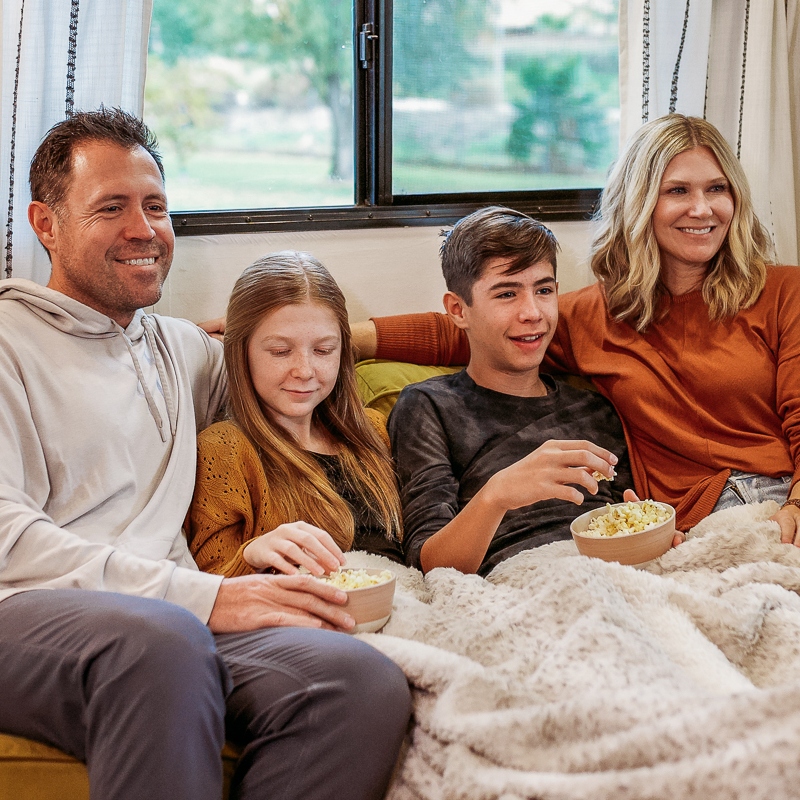 The Wanderpreneur family sitting together, including both parents and two children