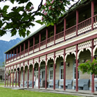 A large brightly coloured heritage building. 