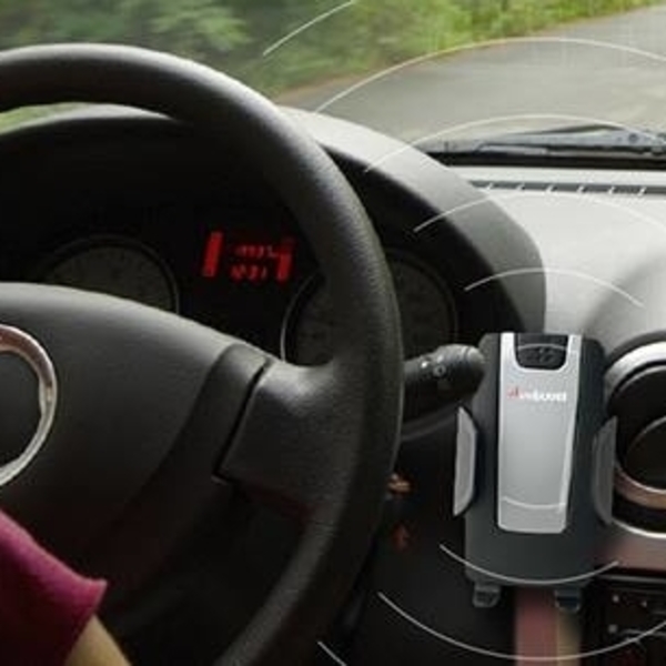 cellphone attached on the dashboard of a vehicle