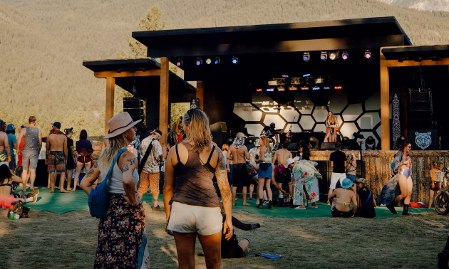 People at a music festival stage