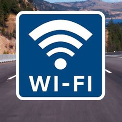 A road sign with the wi-fi symbol on it.  