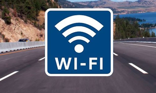 A road sign with the wi-fi symbol on it.