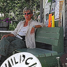 lady sitting on a bench in front of the Wildcat Cafe in Yellowknife, Northwest Territories