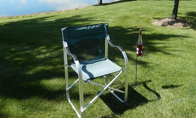 Backyard Butler Wine Bottle Holder next a lawn chair. 