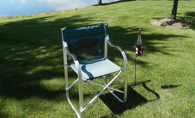 Backyard Butler Wine Bottle Holder next a lawn chair.