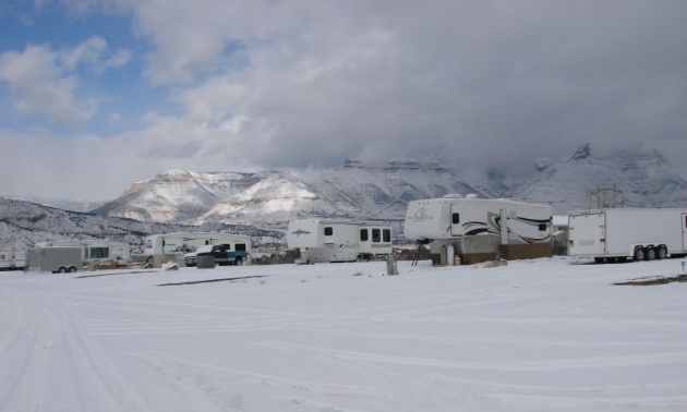 RVs in a lot during a snowy winter