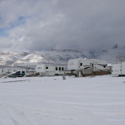 RVs in a lot during a snowy winter