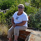 lady sitting on a rock at writing on stone provincial park
