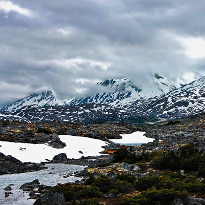 Picture of Yukon, with grassland and mountains in background. 